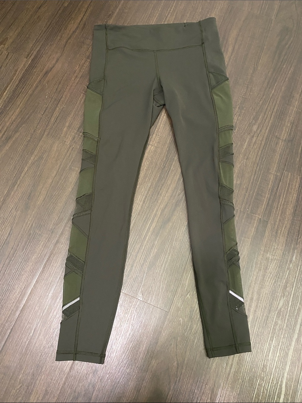 lululemon dark olive green workout leggings with reflective logo